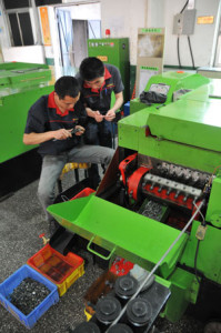 Two of our engineers hard at work at our factory.